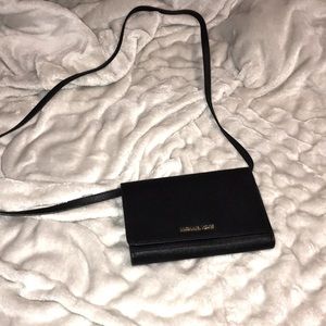 Michael Kors Crossbody in black. Size is 8 inches x 6 inches